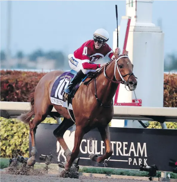  ?? — THE ASSOCIATED PRESS ?? Jockey Florent Geroux shouts with joy as Gun Runner crosses the finish line to win the Pegasus World Cup Invitation­al Saturday at Gulfstream Park in Hallandale Beach, Fla., giving the reigning horse of the year about $16 million in career earnings.