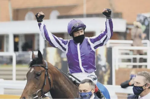  ??  ?? 0 Frankie Dettori celebrates in the winner’s enclosure after his victory in the 1000 Guineas on Mother Earth at Newmarket yesterday