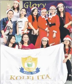  ?? — Photos by Othman Ishak ?? The students from Kolej ITA never miss participat­ing in the annual Christmas Parade event.