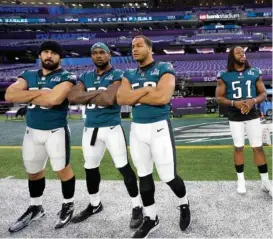  ?? THE ASSOCIATED PRESS ?? From left, Philadelph­ia Eagles inside linebacker Joe Walker, outside linebacker Nigel Bradham, middle linebacker Jordan Hicks and defensive end Steven Means prepare for a walk-through Saturday for tonight’s Super Bowl LII in Minnesota.