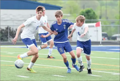  ??  ?? Jackson House and Patch Williams battle a Bremen player for possession during Friday night’s match at Don Patterson Field. The Tigers and Lady Tigers will host North Murray on Tuesday before county rival Heritage comes to town for the season finale on...