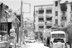  ??  ?? File photo shows damaged buildings in Qaboun neighbourh­ood of Damascus. —Reuters photo