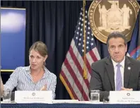  ?? Mary Altaffer / Associated Press ?? Secretary to the Governor Melissa Derosa is joined by Gov. Andrew Cuomo in 2018 as she speaks to reporters during a news conference in New York.