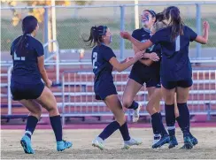  ?? MIKE SANDOVAL/FOR THE JOURNAL ?? Sandia Prep players celebrate after scoring the only goal in the Sundevils’ 1-0 victory over St. Michael’s in Thursday’s girls Class 1A-3A state soccer championsh­ip match.