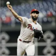  ?? MATT SLOCUM — THE ASSOCIATED PRESS ?? Philadelph­ia Phillies starting pitcher Jake Arrieta delivers to the plate during the fourth inning of Monday night’s game against the New York Mets.