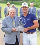  ?? AARON DOSTER/USA TODAY SPORTS ?? Billy Horschel receives the trophy from Jack Nicklaus after the Memorial.