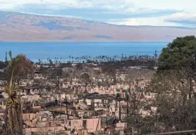  ?? ?? Homes consumed in recent wildfires are seen in Lahaina, Hawaii, on Wednesday. Many in Lahaina already struggled to afford life in Hawaii before the fire.