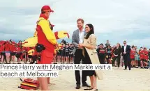  ??  ?? Prince Harry with Meghan Markle visit a beach at Melbourne.