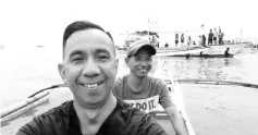  ??  ?? The Borneo Post reporter with Gill. B. Asentista and a villager using a pump boat joining the boats float parade.