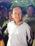  ?? AFP ?? Police take away former opposition leader Kem Sokha, who was arrested in a midnight raid in September and later charged with ‘treason’.