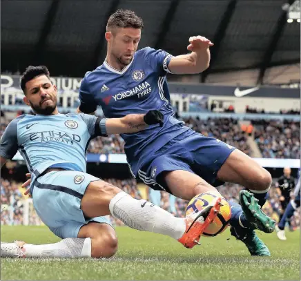  ?? Picture: EPA ?? BRUISING ENCOUNTER: Manchester City’s Sergio Aguero, left, tackles Chelsea’s Gary Cahill during yesterday’s English Premier League match at the Etihad Stadium in Manchester.