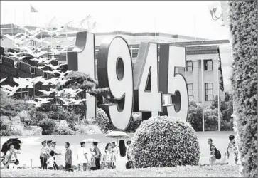  ?? Ng Han Guan Associated Press ?? IN BEIJING, Tiananmen Square is decorated for a military parade to mark the anniversar­y of the end of World War II. Members of Chiang Kai-shek’s forces are getting some overdue recognitio­n for fighting Japan.