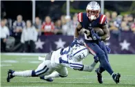  ?? AP Photo/Steven Senne ?? ■ New England running back James White (28) eludes Indianapol­is cornerback Lenzy Pipkins (37) on Thursday in Foxborough, Mass.