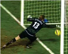  ?? SKY SPORTS/ ALAN LEWIS ?? Jeepers keepers: Carroll (right) near Enniskille­n Castle and (left) scooping the ball back after spilling Pedro Mendes’ long-range effort for Spurs
