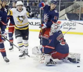  ?? Associated Press ?? Evan Rodrigues scores on a power play against the New York Rangers’ Igor Shesterkin in Thursday’s 5-2 win.