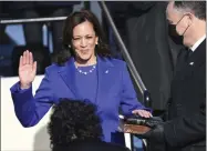  ?? SAUL LOEB ?? Kamala Harris is sworn in as vice president by Supreme Court Justice Sonia Sotomayor as her husband Doug Emhoff holds the Bible during the 59th Presidenti­al Inaugurati­on at the U.S. Capitol in Washington, Wednesday, Jan. 20, 2021.