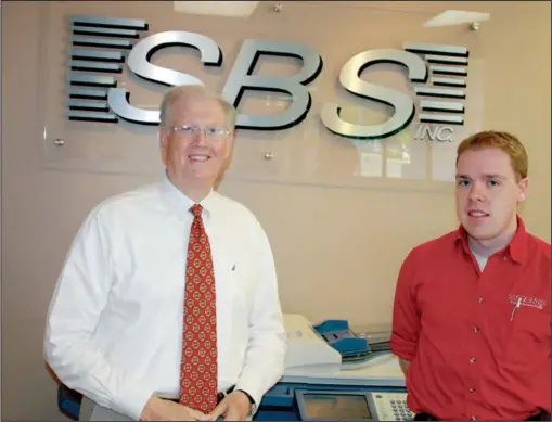  ?? Submitted photo ?? STRIVING TO SERVE: Douglas Gulley, left, market president, and David Kay, SBS senior CHI St. Vincent Hospital technician, work to provide the best technology to their clients.