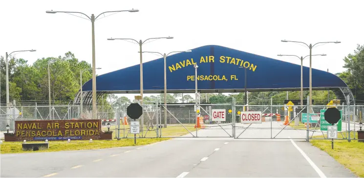  ?? Josh Brasted / Get y Images ?? The Pensacola Naval Air Station in Florida was the scene of the second shooting on a U. S. naval base in a week. The attack, being blamed on a Saudi airman on a training program, left three dead plus the suspect and eight people wounded.