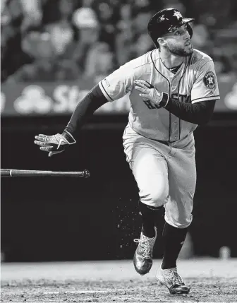  ?? Kyusung Gong / Associated Press Outfielder George Springer watches his three-run homer during the fifth inning, a shot that gave the Astros an 11-0 lead Wednesday night. ??