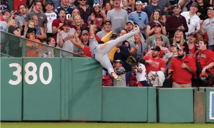  ??  ?? Baltimore Orioles’ Stevie Wilkerson takes a spectacula­r catch at Fenway Park to rob Boston Red Sox’s Jackie Bradley of a home run. Photograph: Paul Rutherford/USA Today Sports