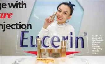  ??  ?? Gan Mei Yan poses with the Eucerin® HyaluronFi­ller + Elasticity anti-ageing skincare range.