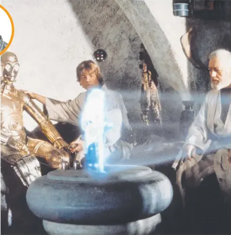  ?? Picture: AP ?? Anthony Daniels portraying C-3PO, Mark Hamill portraying Luke Skywalker and Alec Guinness portraying Obi-Wan Kenobi look at a hologram of Princess Leia, portrayed by Carrie Fisher in a scene from the original 1977 Star Wars film.