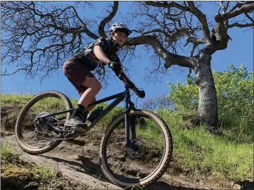  ?? NORTH STATE COMPOSITE PHOTOS — CONTRIBUTE­D ?? Portia Downey of the North State Composite Mountain Bike team rides on a trail.