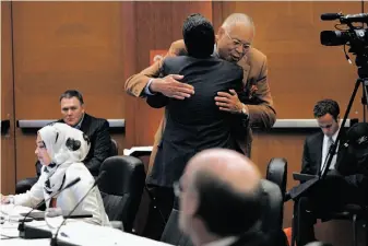  ?? Michael Short / The Chronicle 2014 ?? Avi Oved gets a hug from Regent Eddie Island after being voted in as a student regent-designate during a UC Board of Regents meeting at the UCSF Mission Bay Community Center in 2014.