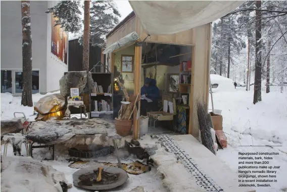  ??  ?? Repurposed constructi­on materials, bark, hides and more than 200 publicatio­ns make up Joar Nango’s nomadic library Girjegumpi, shown here in a recent installati­on in Jokkmokk, Sweden.