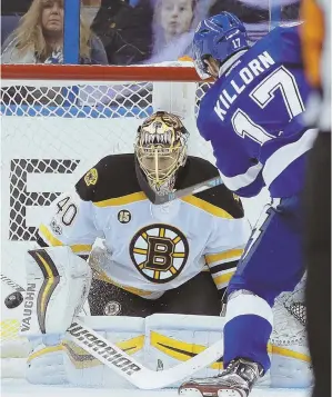  ?? AP PHOTOS ?? BACK WITH A BANG: Frank Vatrano celebrates his eventual game-winner in the Bruins’ 4-3 victory against the Lightning last night; at right, Tuukka Rask makes a stop on Tampa Bay’s Alex Killorn, who scored twice in the loss.