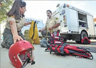  ?? Dan Watson/ The Signal (See additional photos on signalscv.com) ?? Santa Clarita Valley Search and Rescue team members, civilian volunteer Alison Arisohn, left, and reserve Capt. Dave Christians­on display some of their swift-water training equipment Tuesday at the Santa Clarita Valley Sheriff’s Station in Valencia.