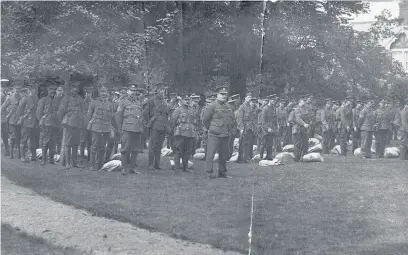  ??  ?? Men of the 5th Battalion Leicesters­hire Regiment gather in Loughborou­gh’s Queen’s Park ready to go to war.