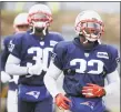  ?? Steven Senne / Associated Press ?? Patriots free safety Devin McCourty, right, and his brother cornerback Jason McCourty warm up during practice.