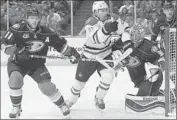 ?? Robert Gauthier Los Angeles Times ?? DALLAS’ Antoine Roussel knocks Ducks goalie Frederik Andersen as he skates past Saku Koivu.