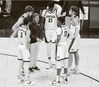  ?? Andy Lyons / Getty Images ?? Coach Mark Few and No. 1 Gonzaga had a scare against No. 11 West Virginia on Wednesday at the Jimmy V Classic before prevailing 87-82. Next up is No. 2 Baylor, an 82-69 winner over Illinois.