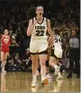  ?? CLIFF JETTE — THE ASSOCIATED PRESS ?? Iowa’s Caitlin Clark celebrates after becoming the all-time leading scorer in NCAA DI basketball on Sunday, in Iowa City, Iowa.