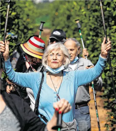  ?? PHOTO: REUTERS ?? Let it go: People take part in a screaming session as they seek emotional release from Covid restrictio­ns in an orchard near Ra’anana, Israel. Around 38pc of Israel’s 9 million population have received at least one vaccine dose.