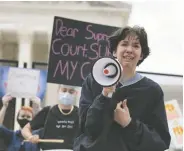  ?? ANNA MONEYMAKER / GETTY IMAGES ?? Hannah Yost speaks at an abortion-rights rally at the U.S. Supreme Court building on Thursday.