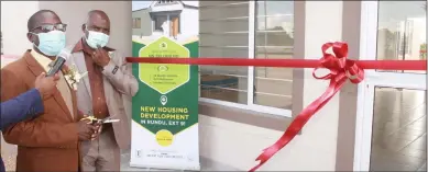  ?? Photo: John Muyamba ?? Housing solutions… Urban and rural developmen­t minister Erastus Uutoni with Rundu mayor Gabriel Kanyanga before cutting the ribbon to hand over the new houses on Friday.