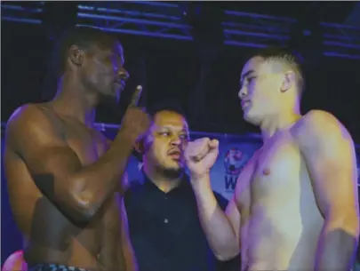  ??  ?? FALLEN GIANT . . . Zimbabwean boxer Charles Manyuchi (left) meets his conqueror Qudratillo Abduqaxoro­v before the Uzbek ruthlessly knocked him out in the first round of their WBC silver welterweig­ht title fight in Singapore on Saturday