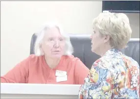  ?? Keith Bryant/The Weekly Vista ?? City council member Linda Lloyd (left), talks with finance director Cary Elsten while trying out a seat at the new court facility. The facility will be used for city council meetings starting this month.