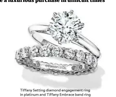  ??  ?? Tiffany Setting diamond engagement ring in platinum and Tiffany Embrace band ring in platinum with diamonds