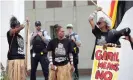  ?? Photograph: Mike Bowers/The Guardian ?? Polly Cutmore, right, leads the protest outside Parliament House in Canberra.