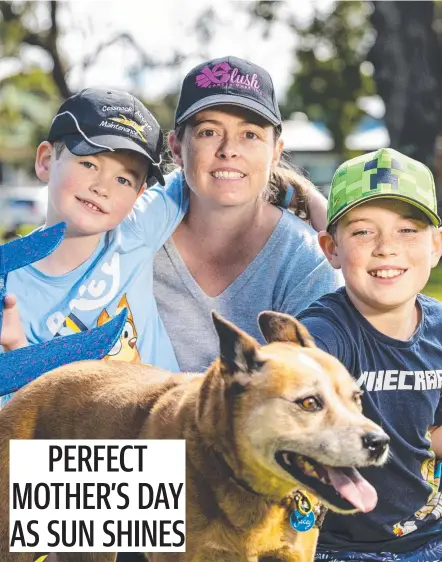  ?? Picture: Kevin Farmer ?? HAPPY MOTHER’S DAY: Celebratin­g Mother’s Day at the Queensland State Rose Garden were Rebecca Bridge with her sons Bradley (left) and James and their dog Jacey.
