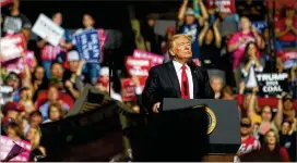  ?? JEFF SWENSEN / GETTY IMAGES ?? President Donald Trump speaks to supporters at his rally inside the WesBanco Arena on Saturday in Wheeling, West Virginia.