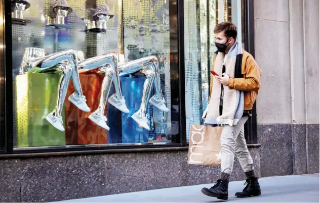  ?? Reuters ?? ↑
A man shops on the 5th Avenue in New York on Wednesday.