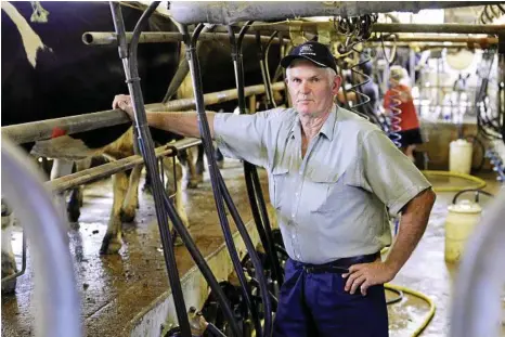  ?? PHOTO: CLAUDIA BAXTER ?? DO BETTER: Dairy farmer Ross McInnes said supermarke­t milk wars definitely had an impact on the Queensland dairy industry despite the ACCC finding otherwise in its recent inquiry.