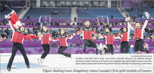  ?? THE CANADIAN PRESS/PAUL CHIASSON ?? Canada’s Scott Moir, left to right, Tessa Virtue, Gabrielle Daleman, Eric Radford, Meagan Duhamel, Kaetlyn Osmond, and Patrick Chan celebrate their gold medal victory in the team figure skating event at the Pyeonchang Winter Olympics Monday in...