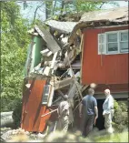  ?? Carol Kaliff / Hearst Connecticu­t Media ?? A house on Old Hemlock Road in Brookfield was heavily damaged by May’s macroburst. The Federal Emergency Management Agency, Brookfield officials and U.S. Rep. Elizabeth Esty toured areas of Brookfield in June.