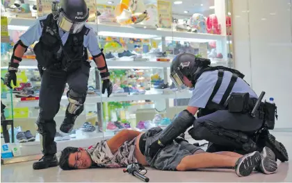  ??  ?? Clashes erupted between pro-democracy protesters and supporters of the Chinese regime at a Hong Kong shopping mall on September 14, 2019.